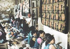 Tibetan artisans weaving carpets